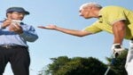 golfer pointing his arm at caddie